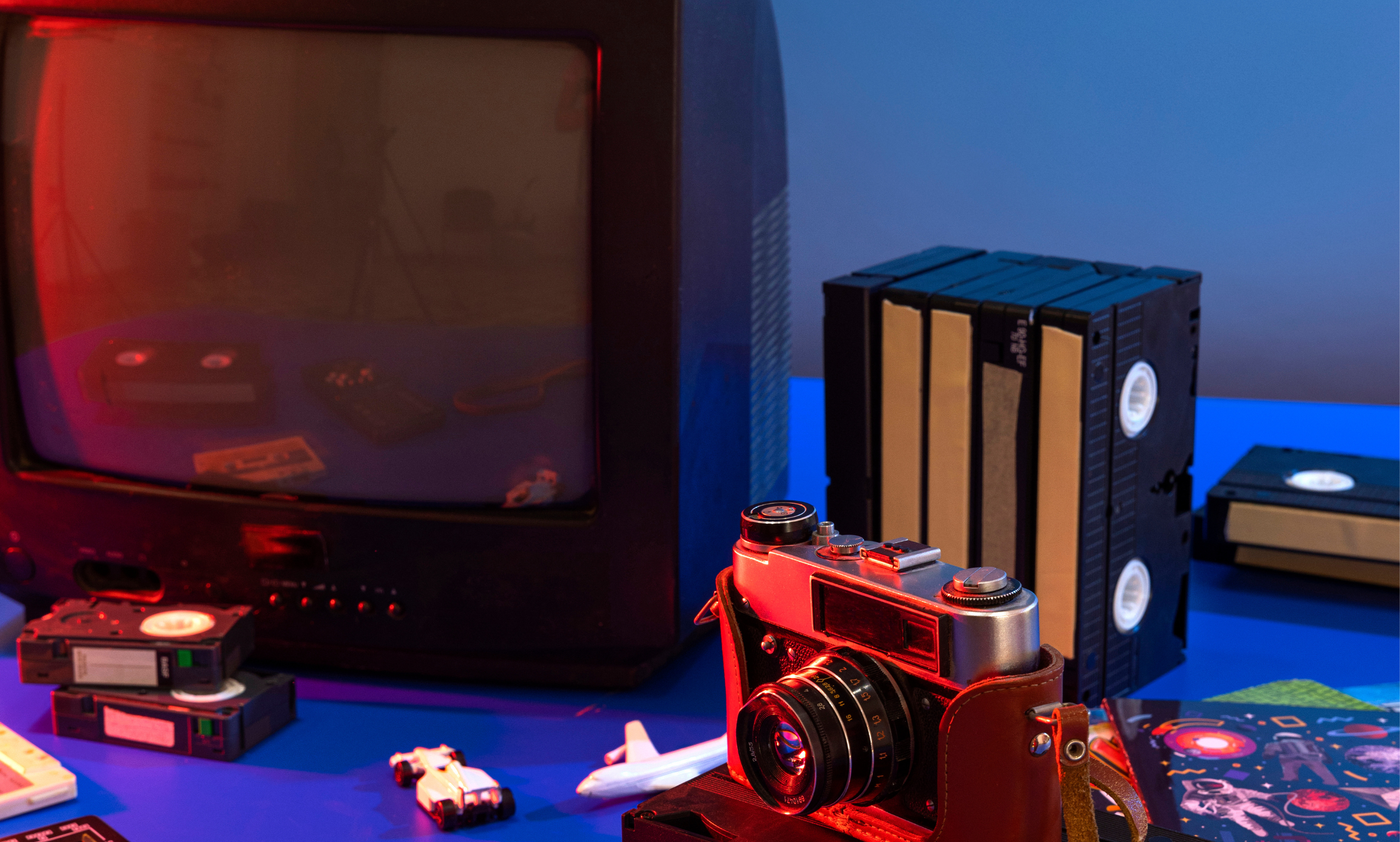 A vibrant collage of film reels, music notes, a microphone, and a television screen symbolizing modern entertainment and media industries.”