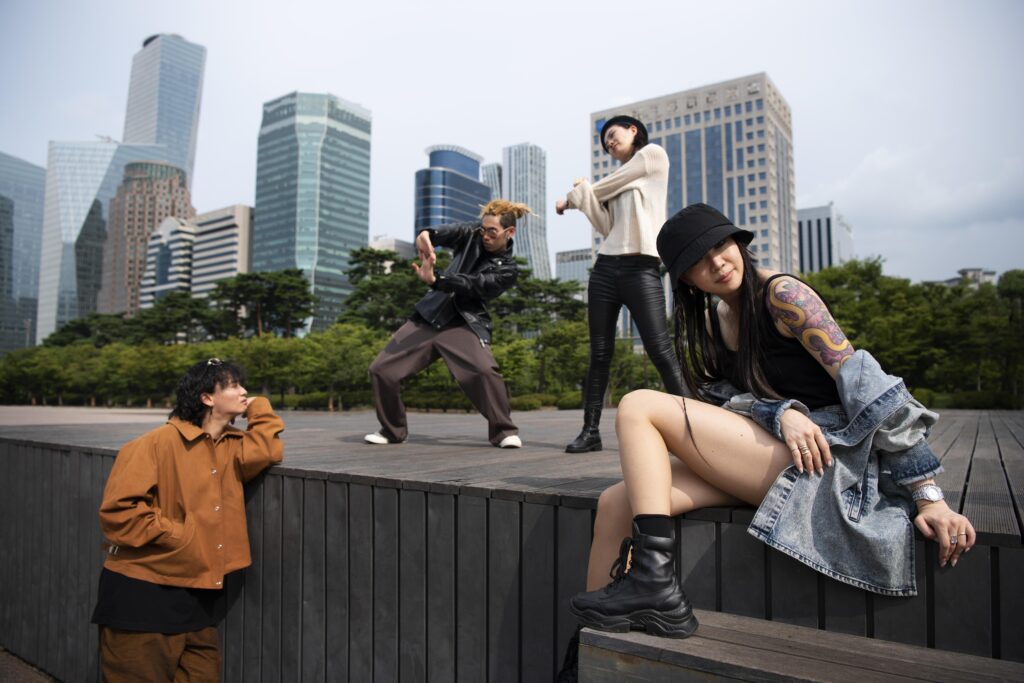 Boys and girls dancing on the street to Asian music beats, capturing 2025 global music trend vibes