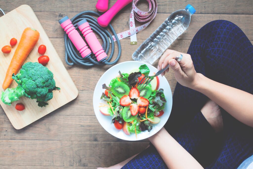 A woman eating healthy food as part of her daily healthy eating habits
