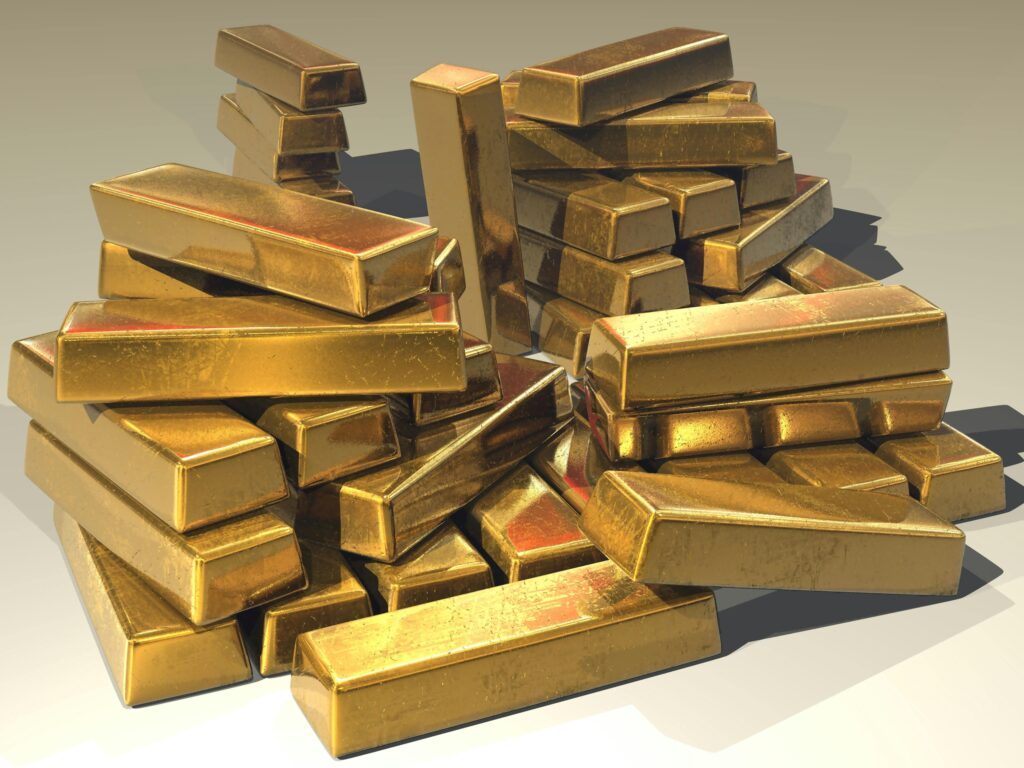 Multiple gold bars stacked together representing rising gold prices in 2025