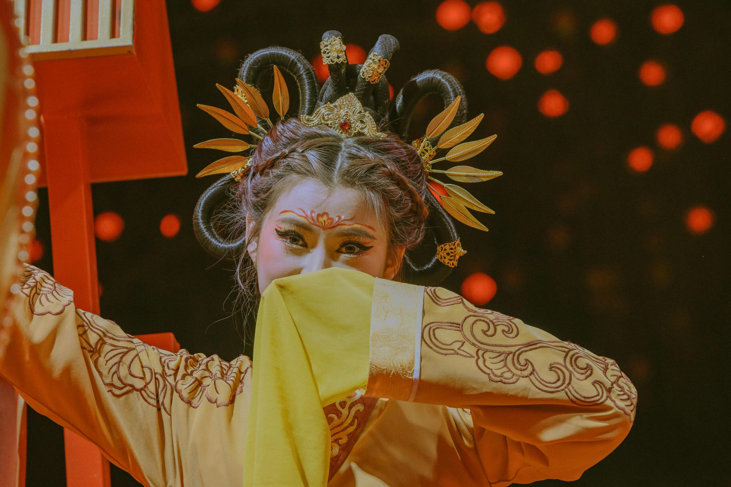 Chinese historical drama scene with a girl holding a traditional fan in elegant costume